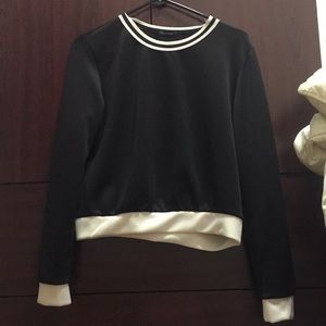 A black long sleeve crop top